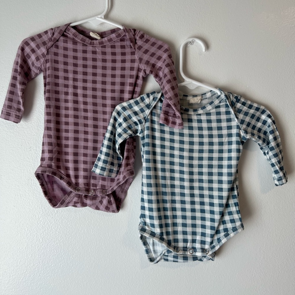 Two Kate Quinn Long Sleeve Onesies